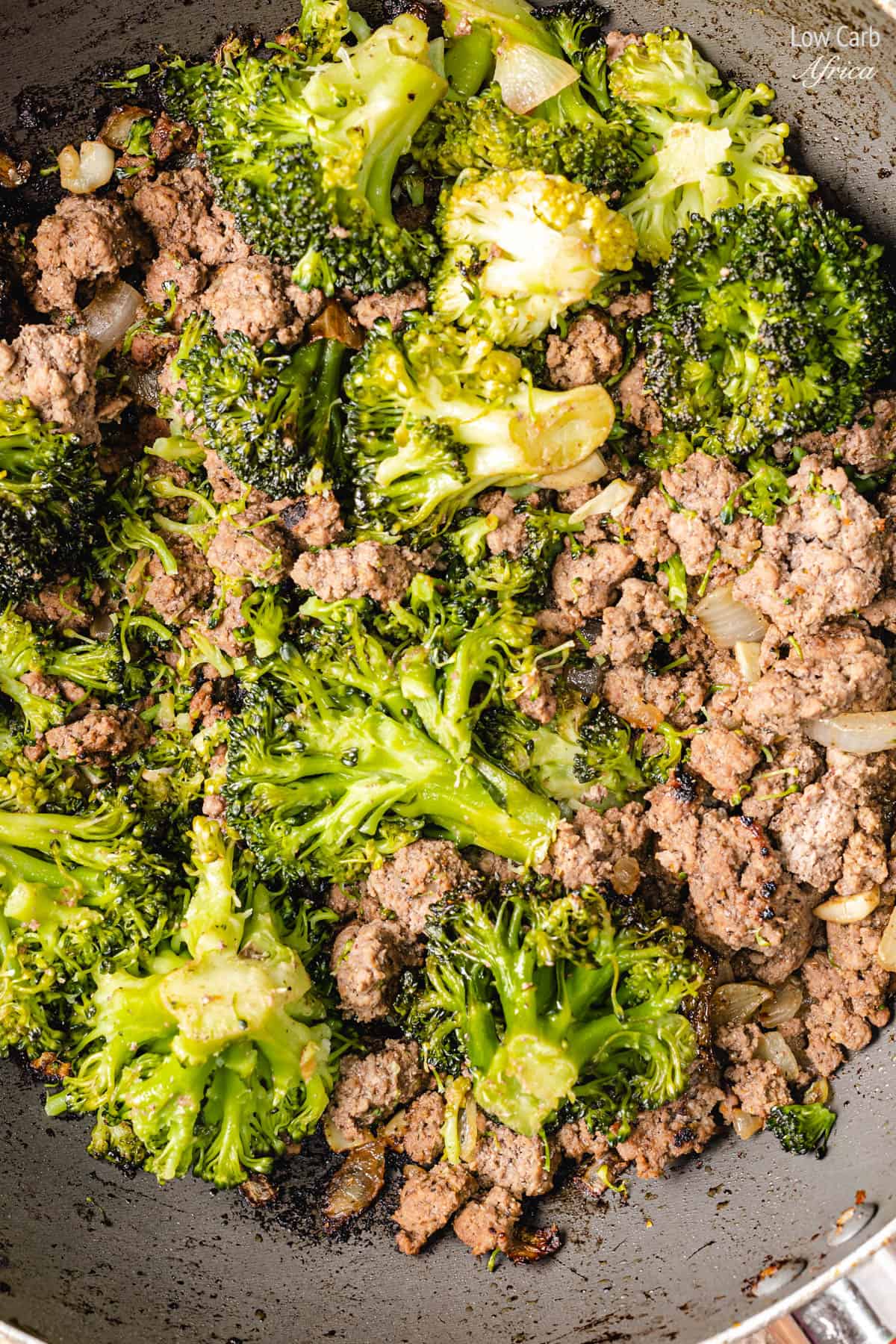 ground beef with broccoli in a pan