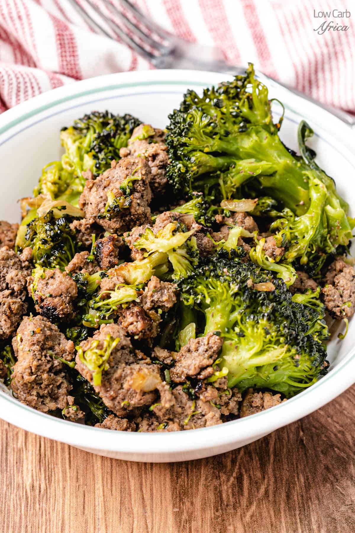 Keto ground beef and broccoli on white plate