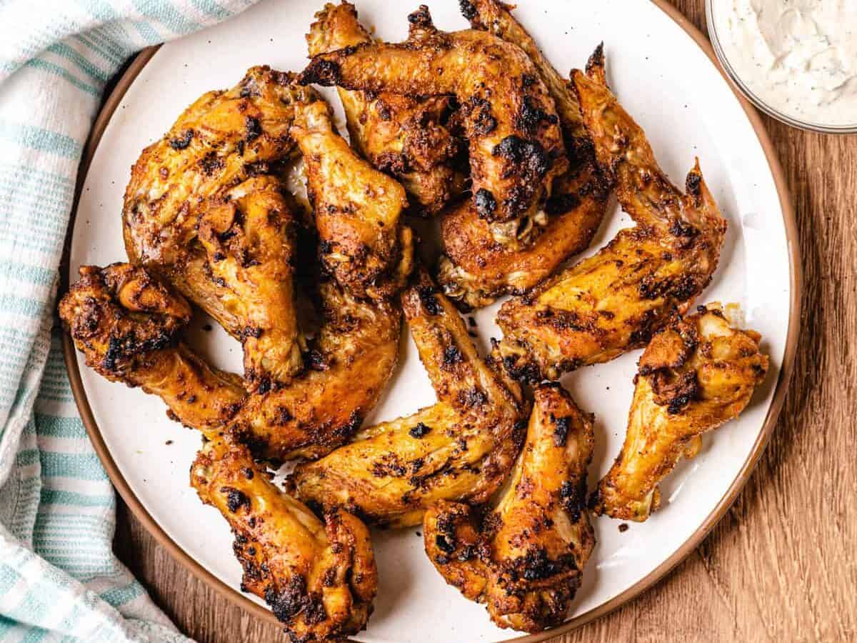 spicy chicken wings on a white plate