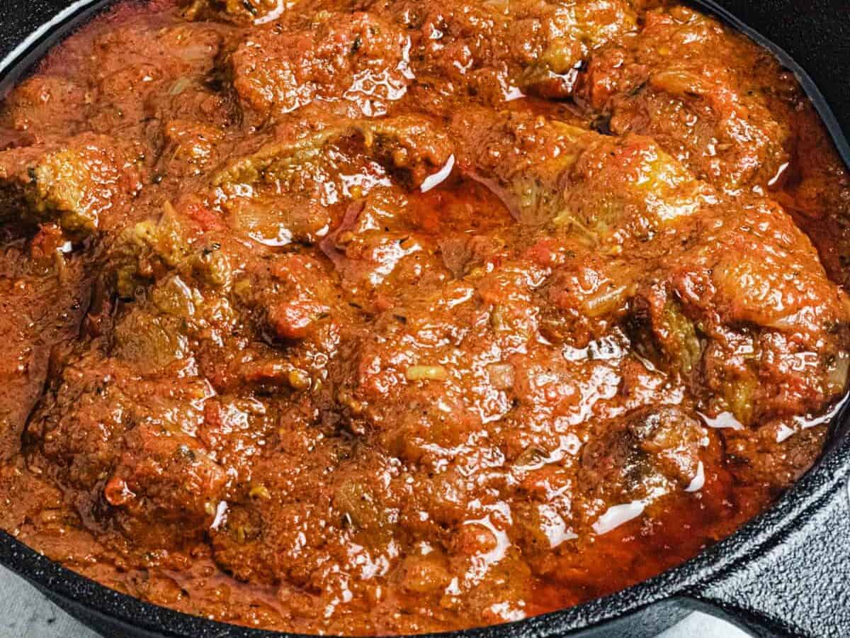 nigerian beef stew in a black cast iron pan