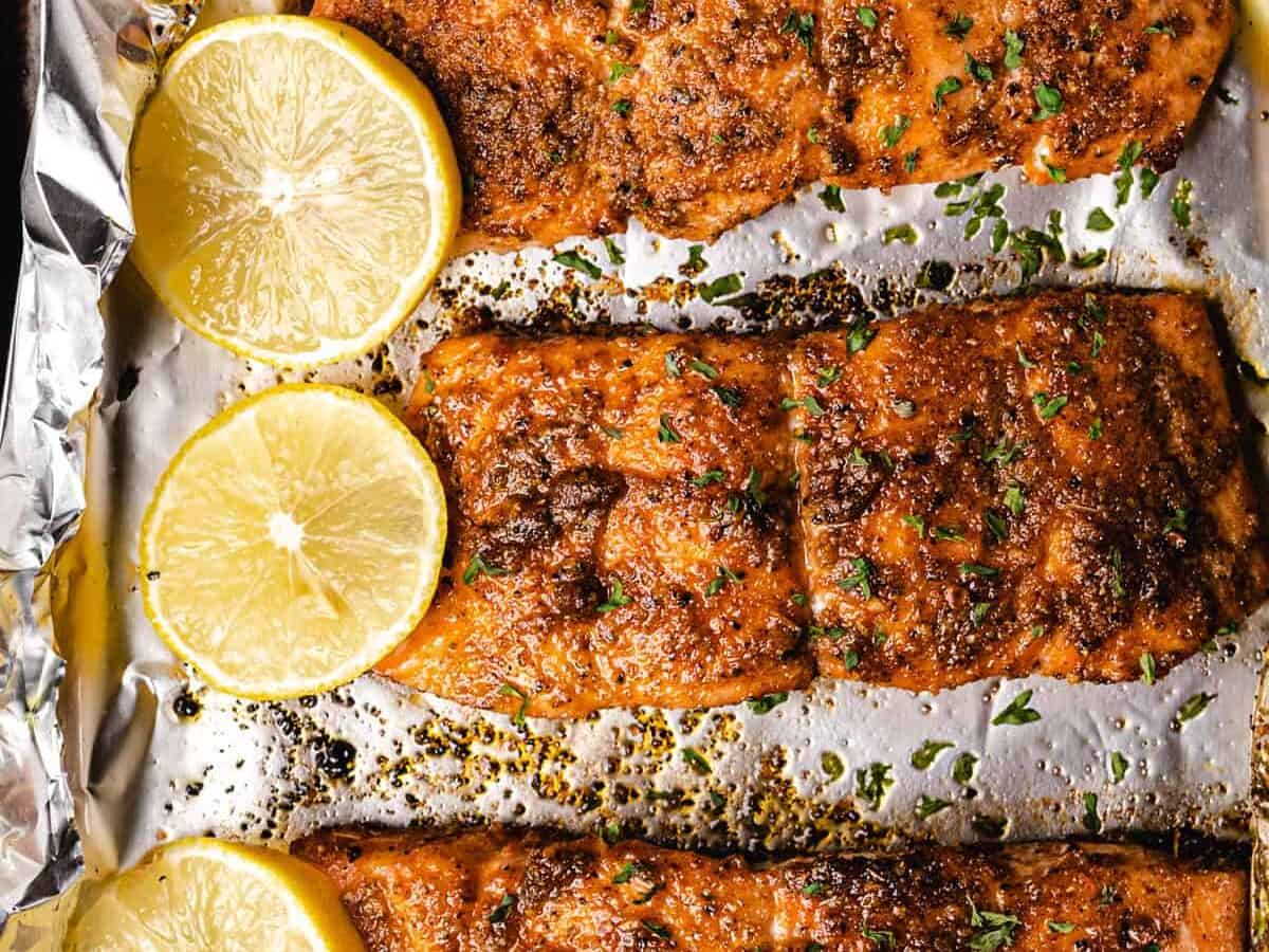 oven baked salmon with lemon wedges