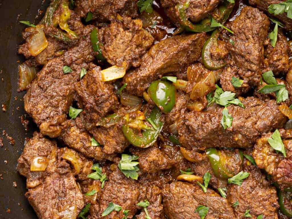 spicy egyptian beef tibs recipe with peppers.