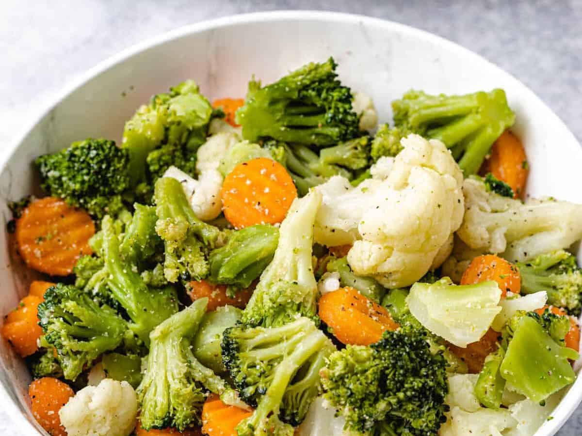 steamed vegetables in a white plate