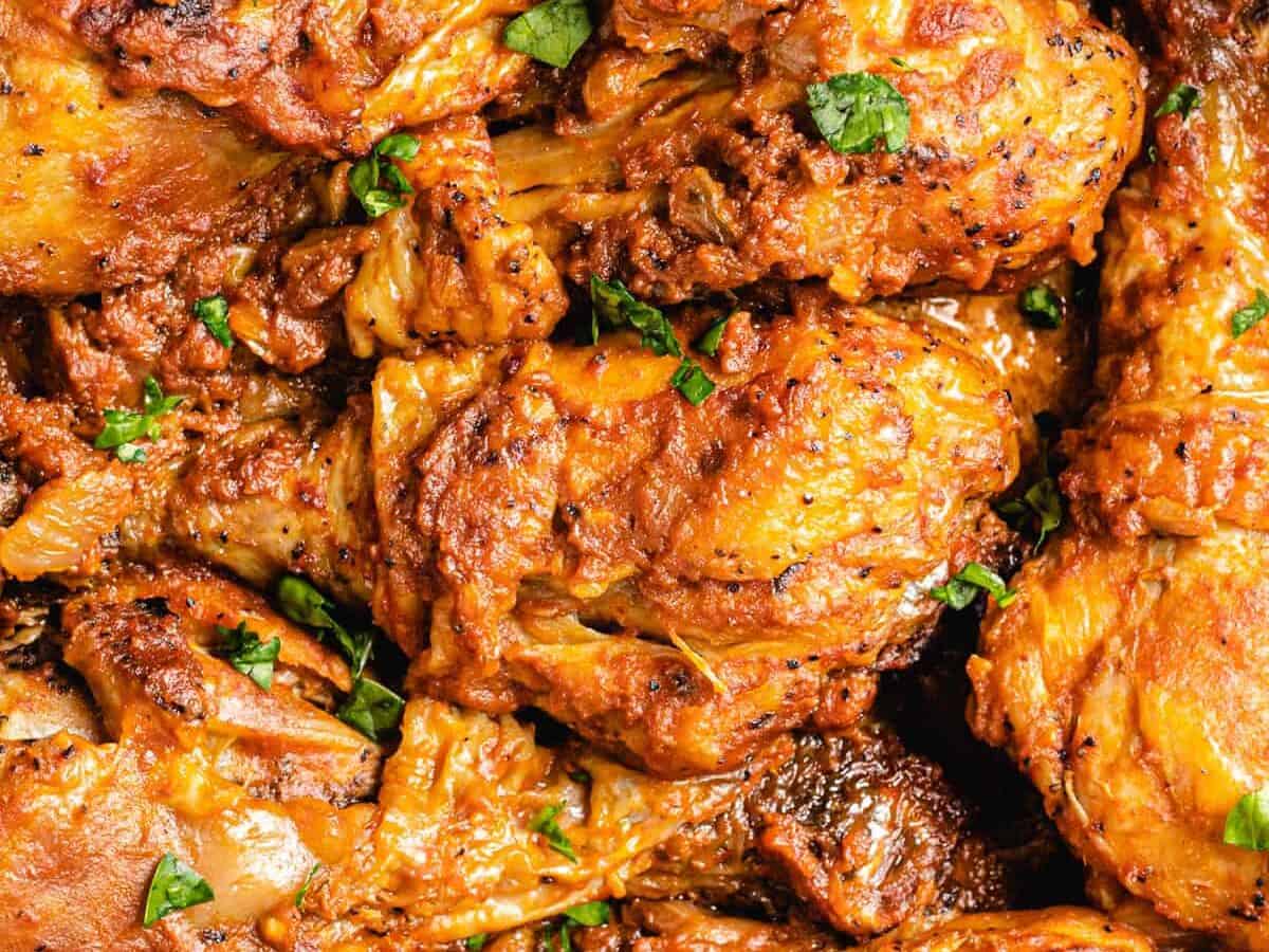 delicious moambe chicken with fresh herbs.