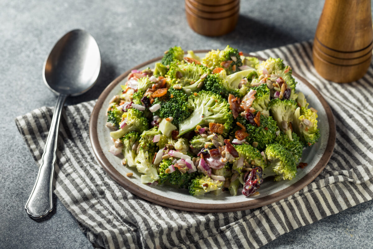 plate with broccoli salad with bacon and other ingredients.