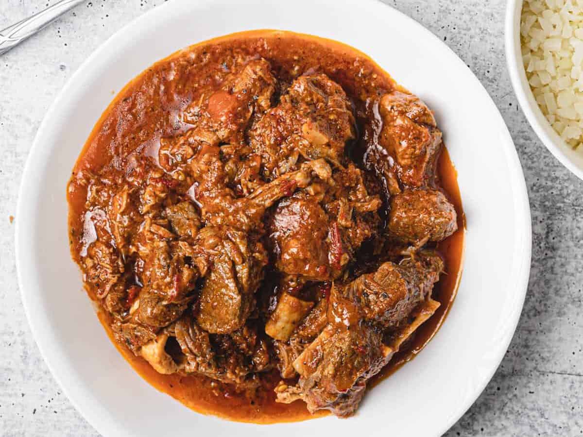 instant pot african lamb stew served on a white plate
