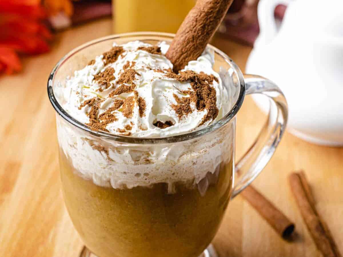 keto pumpkin spice latte with creamer in background
