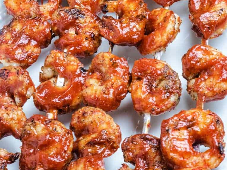 shrimps on a metal skewer with barbecue sauce