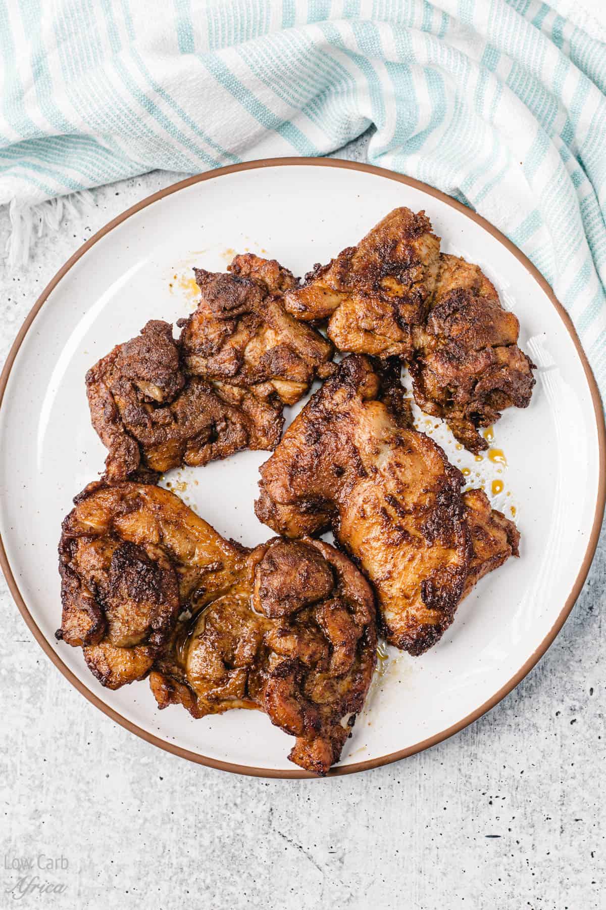 berbere chicken on a white plate