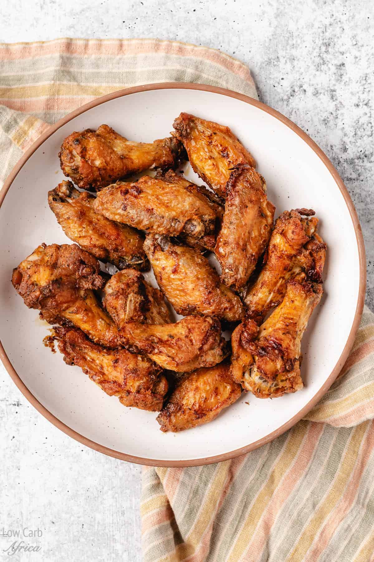 oven fried chicken wings on a white plate