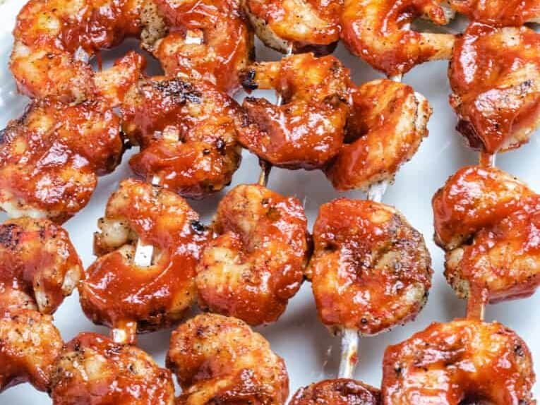 shrimps on a metal skewer with barbecue sauce