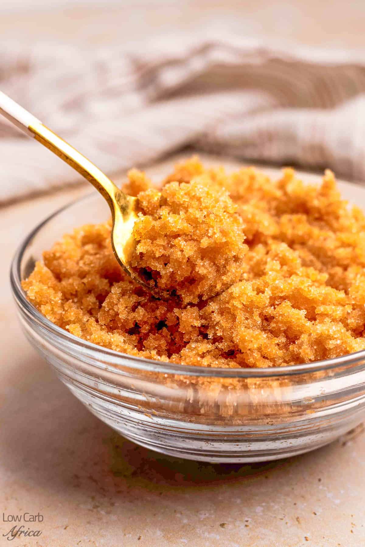 Keto brown sugar in a bowl with a spoon