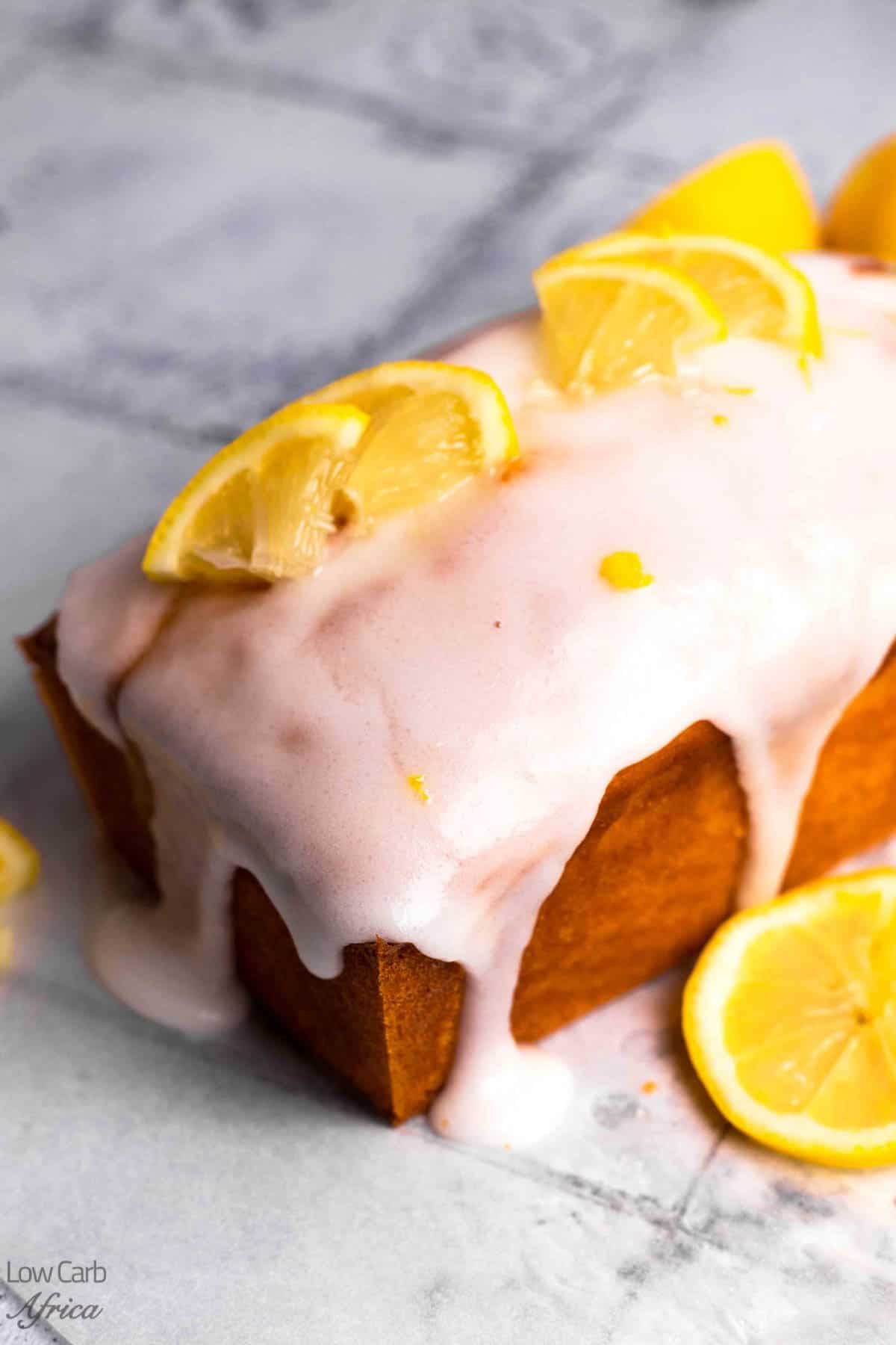 Freshly baked keto lemon cake with lemon garnish